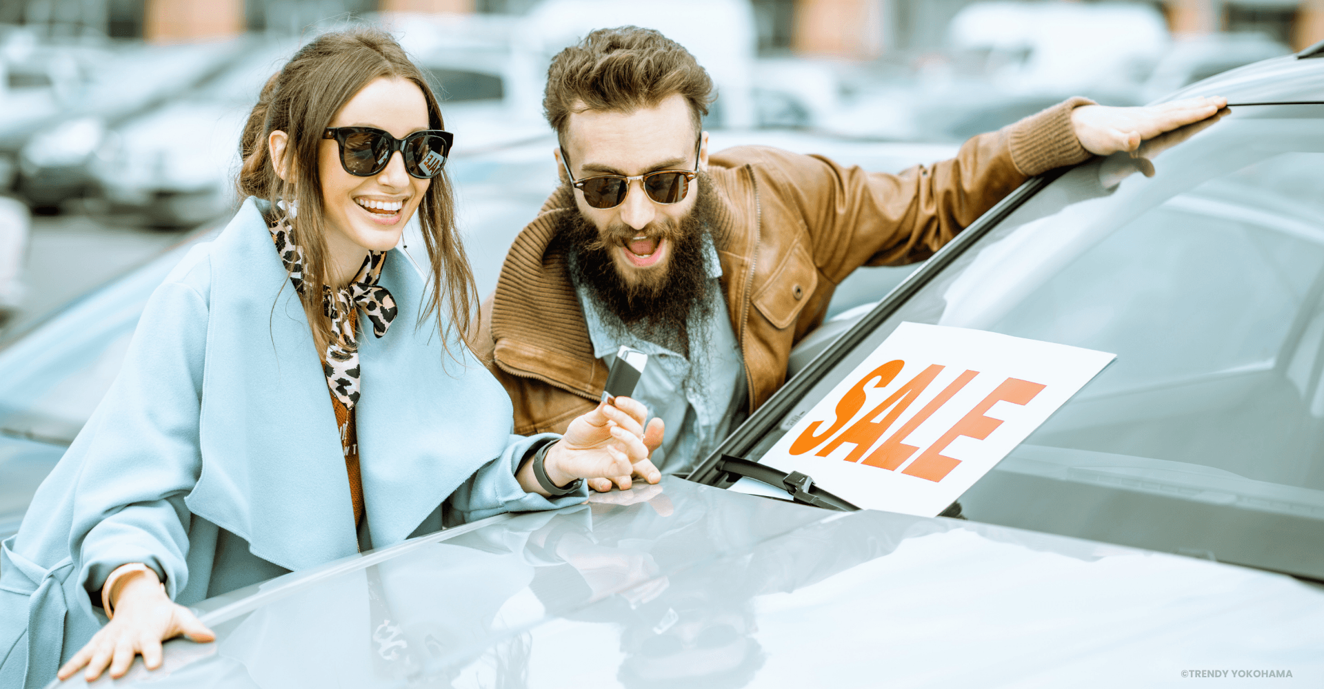 Couple looking at used cars